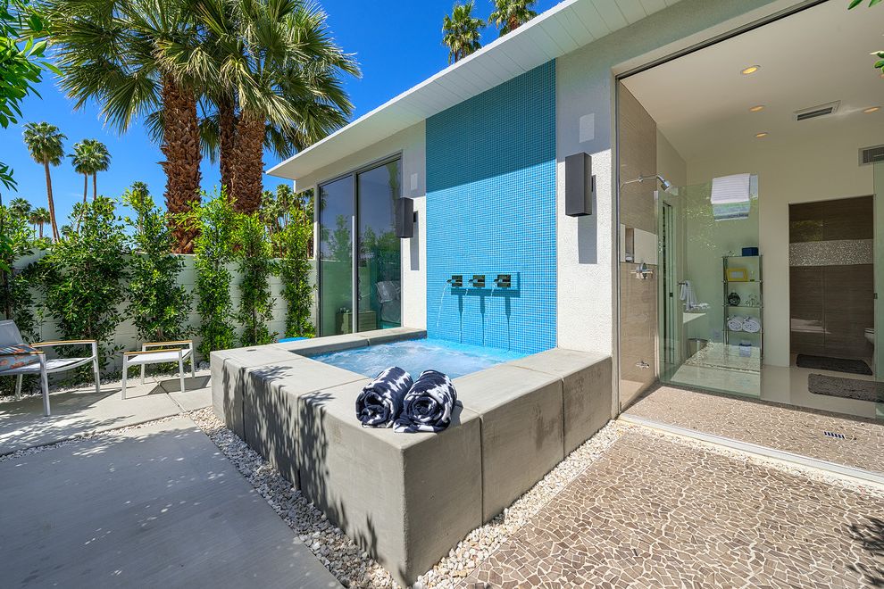 Austin Springs Spa with Modern Patio  and Alexander Alexander House Blue Tile Gravel Mid Century Modern Outdoor Palm Springs Palm Trees Pavers Raised Spa Spa Water Feature