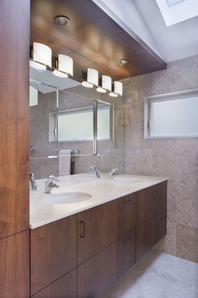 Black Vanity Light Fixtures with Contemporary Bathroom Also Bathroom Mirror Bathroom Storage Ceiling Lighting Double Sinks Double Vanity Recessed Lighting Skylights Wood Cabinets