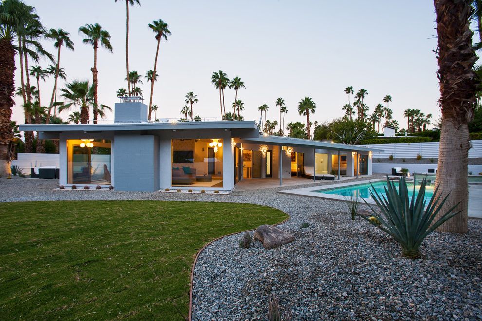Caldera Springs Rentals   Midcentury Exterior  and Alexander Axor Courtyard Covered Patio Hangrohe Landscaping Low Roof Mid Century Modern Palm Springs Palm Trees Pool