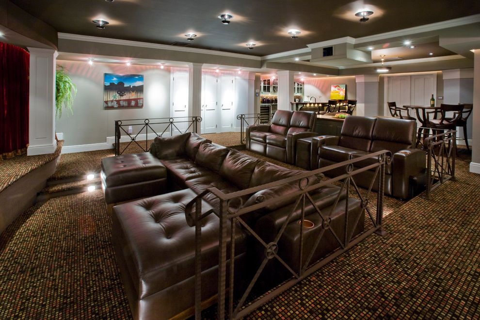 Cedar Falls Theater with Traditional Home Theater Also Basement Beige Ceiling Beige Wall Ceiling Lighting Home Theater Leather Armchair Leather Ottoman Leather Sectional Media Room Metal Railing Movie Room Patterned Carpet White Molding White Trim