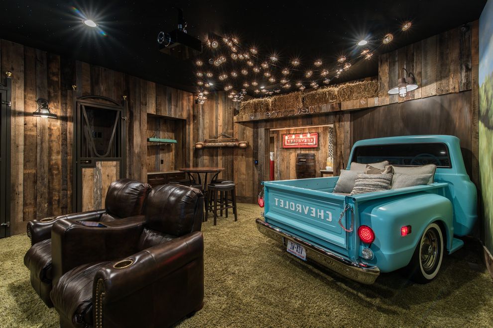 Chevy Chase Theater with Rustic Home Theater  and Car as Decoration Car in House Dark Wood Leather Chairs Green Carpet Industrial Pendant Light Reclaimed Wood Walls Unique