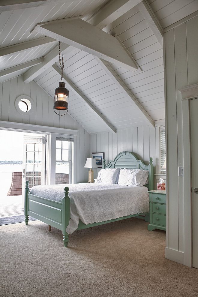 Coleman Furniture Reviews   Beach Style Bedroom  and Carpet Flooring Ceiling Beams French Doors Mint Green Bedframe Panel Walls Pendant Lighting Pitched Ceiling Round Window Ship Light White Walls