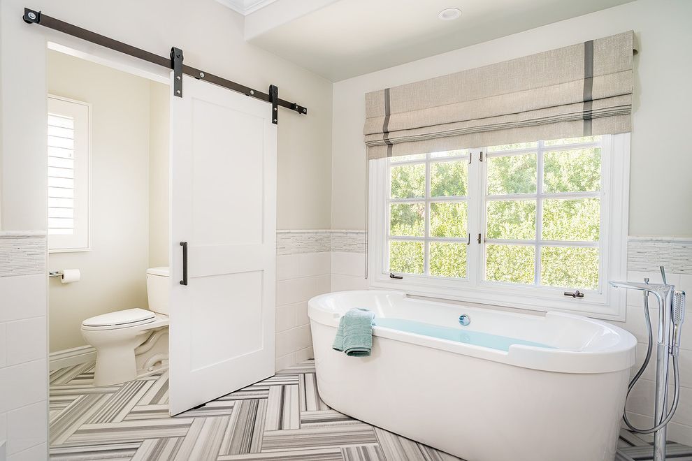 Commercial Grade Toilets with Transitional Bathroom  and Barn Door Bold Chevron Chic Natural Light Neutral Privacy Roman Shades Spa Bath Tile Pattern Windows