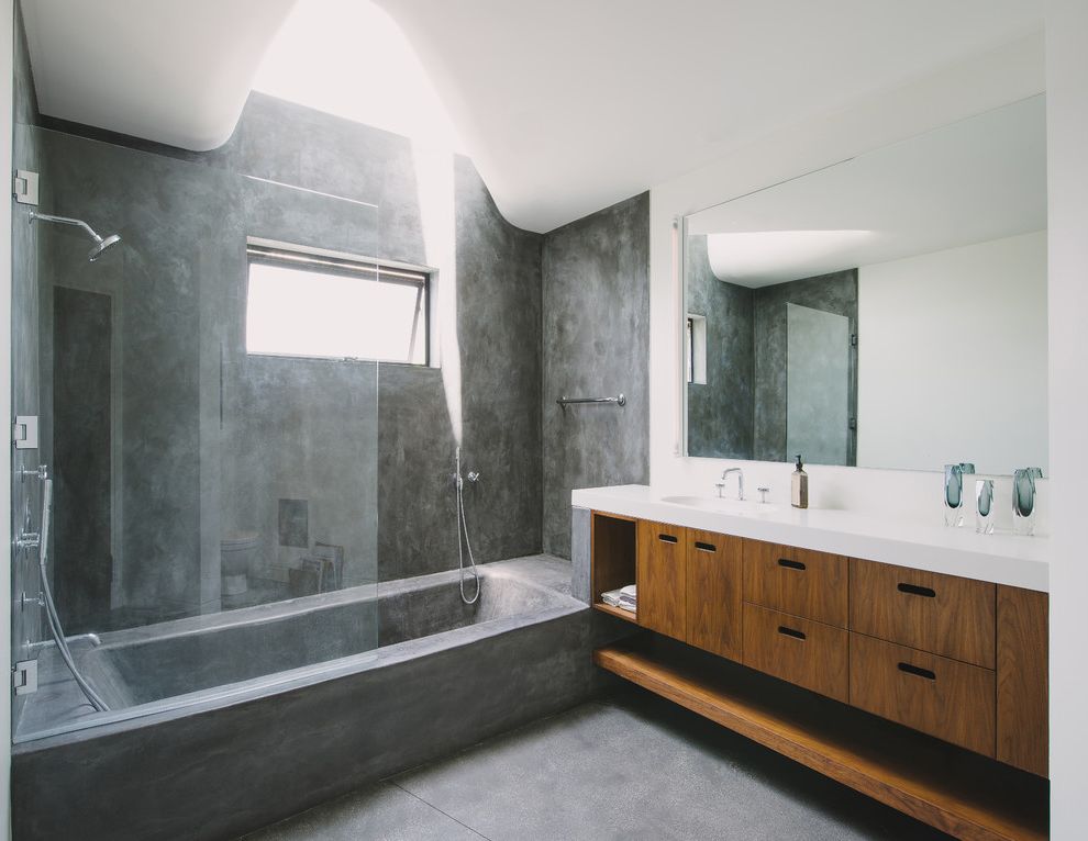 Concrete Contractors San Diego   Modern Bathroom Also Awning Window Bathtub Corian Glass Shower Industrial Mirror Sink Sloped Ceiling Stone White Counter White Wall Wood Vanity