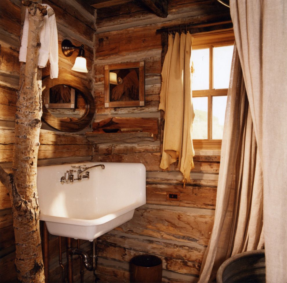 Corner Utility Sink with Rustic Bathroom Also Bathroom Bucket Sink Cabin Candace Miller Architects Chinking Corner Sink Curtain Panel Indoor Tree Lodge Log Home Round Mirror Rustic Wall Sconce Weathered Wood Yellowstone Contractors