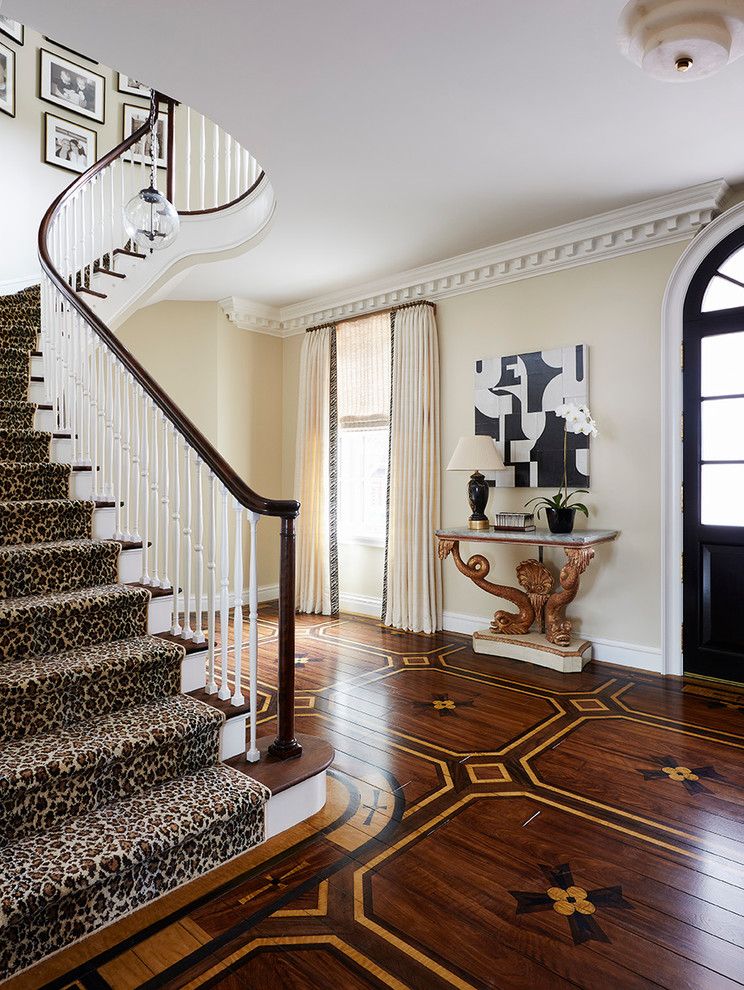 Deans Carpet with Traditional Staircase and Beige Drapes Black and White Abstract Art Cheetah Runner Dentil Molding White and Dark Wood Railing