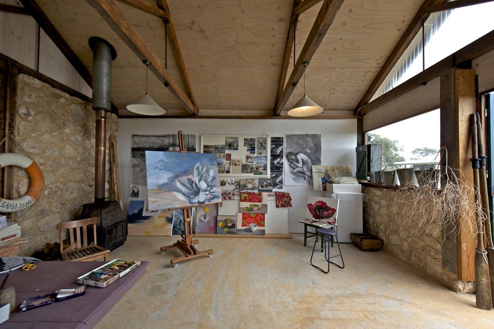 Diamond View Studios with Rustic Home Office  and Art Artisit Studio Combustion Fire Country Easel Exposed Beams Life Preserver Paintings Pendant Lights Plywood Ceiling Rustic Stone Wall Stone Walls Trusses Wood Stove