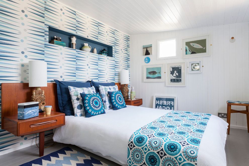 Distinctive Fabrics   Beach Style Bedroom Also Accent Wall Blue Bedroom Chevron Rug Coastal Bedroom Feature Wall Framed Art Gallery Wall Grey Wooden Floor Midcentury Bedside Table Upholstered Stool Wallpaper White Bedding Wood Panelling