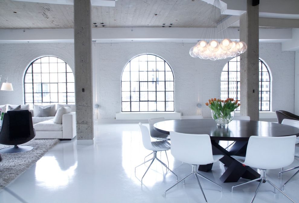 Ditra Heat Mat   Industrial Living Room Also Arched Windows Area Rug Chandelier Cluster Pendant Lights Concrete Columns Industrial Loft Open Painted Brick Round Dining Table Steel Windows White High Gloss Floors White Sofa