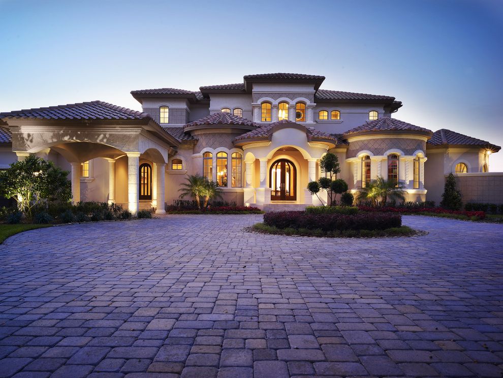 Domain Homes Tampa   Mediterranean Exterior Also Circular Columns Covered Entry Criss Crossing Curved Fence Flowers Garden Grass Hardscape Hip Roof Landscape Lawn Muntins Path Pavers Plants Roof Tile Steps Stucco Trees Walkway Windows