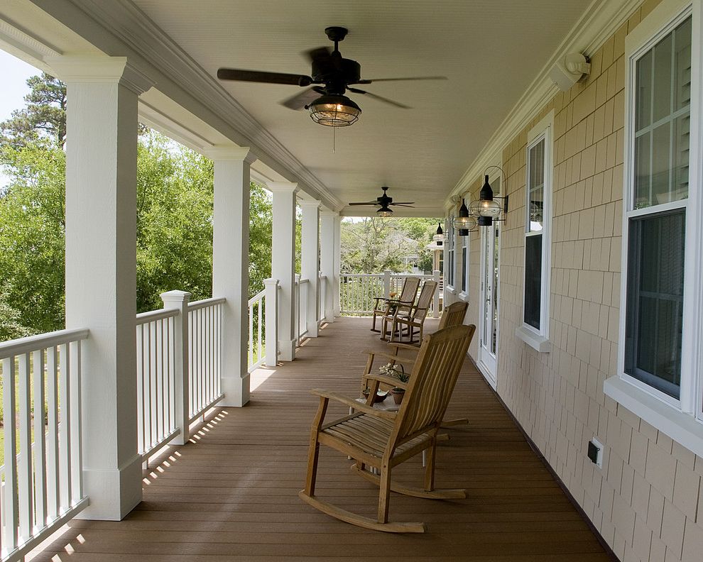 Double Headed Ceiling Fan   Traditional Porch  and Ceiling Fan Deck Handrail Lanterns Outdoor Lighting Patio Furniture Rocking Chairs Shingle Siding White Wood Wood Columns Wood Railing Wood Trim