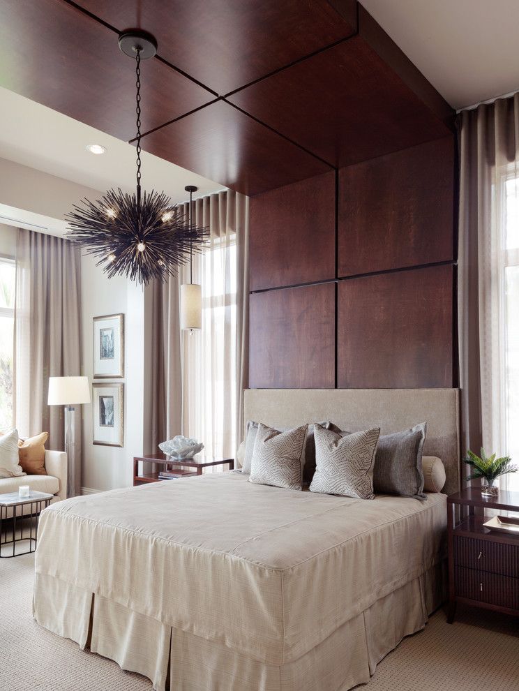 Estuary at Grey Oaks   Contemporary Bedroom Also Beige Carpet Beige Sheer Drapes Beige Upholstered Headboard Dark Wood Panels Fitted Bedspread Fitted Coverlet Spiky Chandelier Wood Accent Wall