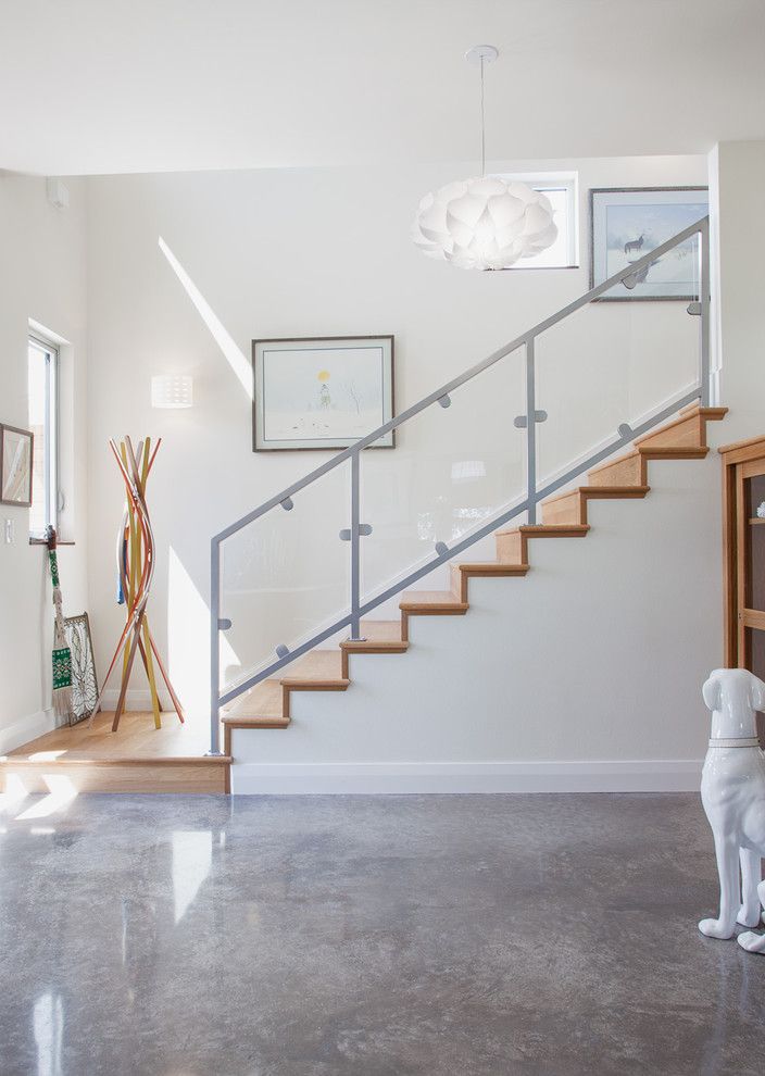 Flooring Over Concrete Options with Contemporary Entry Also Art Wall Ceramic Dog Concrete Floor Glass Railing Metal Railing Modern Coatrack Photo by Kailey J Flynn Photography Staircase White Pendant Light Wood Stairs
