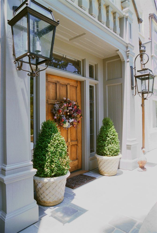 Four Seasons New Orleans   Traditional Entry Also Balcony Color Covered Entry Cozy Frame and Panel Front Door Lanterns Leaded Glass Plant Pots Planters Porch Roof Sconces Side Lights Tile Floor Trim Walls Wood Front Door