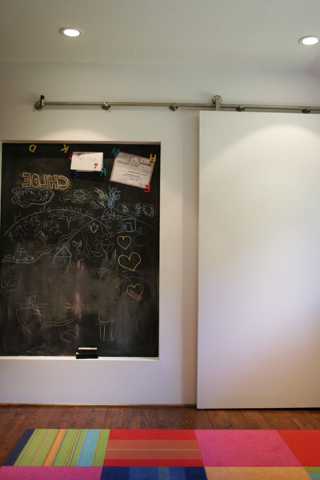 Framed Dry Erase Board with Contemporary Spaces Also Area Rug Barn Door Ceiling Lighting Chalkboard Wall Dark Floor Patchwork Rug Playroom Recessed Lighting Sliding Door Wood Flooring