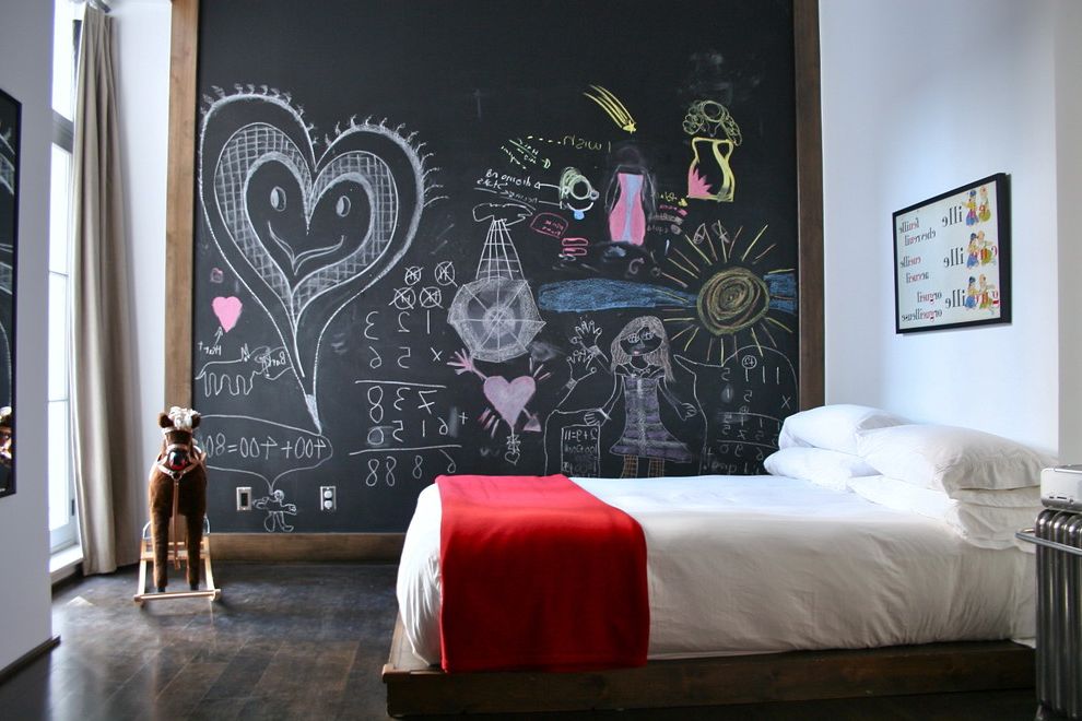 Framed Dry Erase Board with Eclectic Kids  and Chalkboard Wall Dark Floor High Ceilings Red Blanket Rocking Horse Wall Art White Bedding Wood Flooring