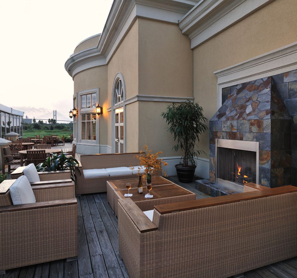 Furniture Stores in Savannah   Traditional Deck Also Arched Window French Doors Outdoor Dining Outdoor Fireplace Radius Window Red Cedar Cladding Slate Fire Surround Stucco Teak White Seat Cushions Wood Deck Woven Outdoor Furniture