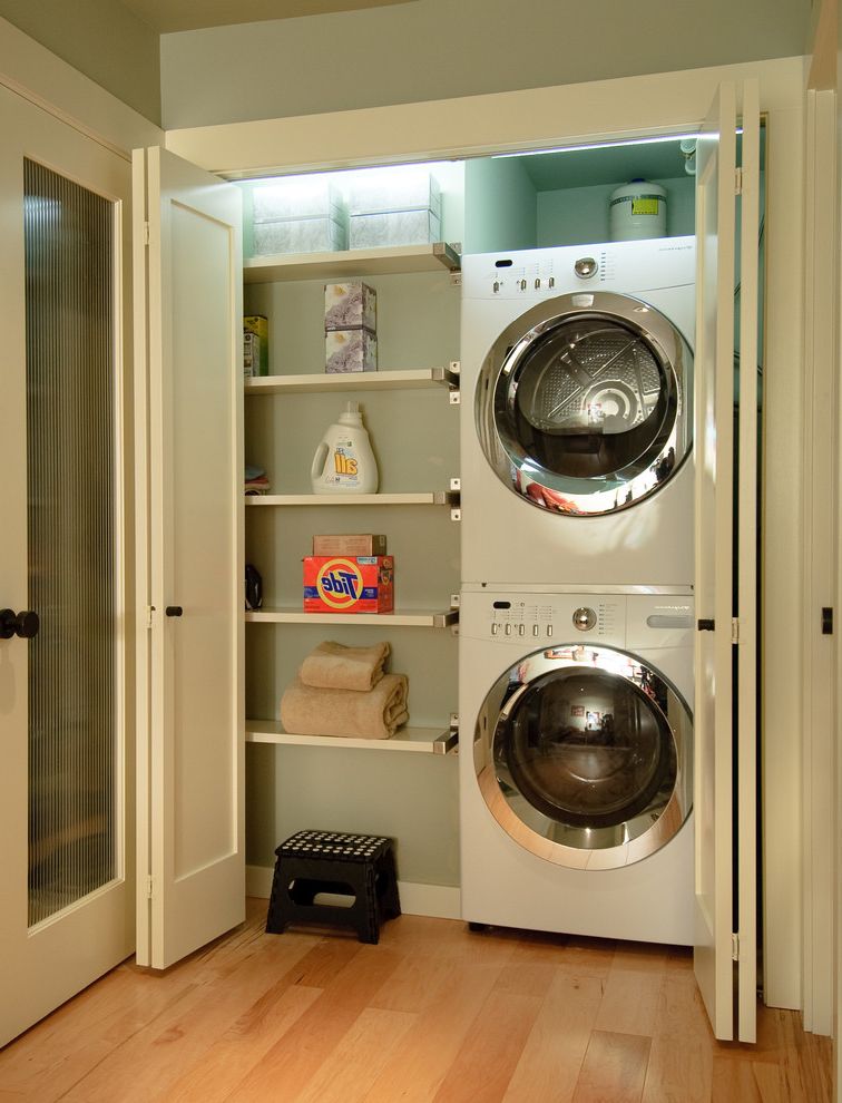 Gas Dryer vs Electric   Contemporary Laundry Room  and Clean Front Loading Washer and Dryer Green Walls Laundry Closet Organized Laundry Room Stackable Washer and Dryer Stacked Washer and Dryer Wall Shelves White Trim Wood Floors
