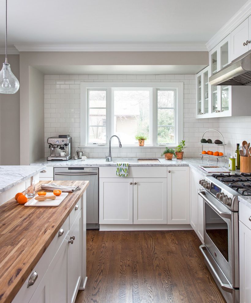 Graves Pro Builds with Traditional Kitchen  and Addition Austin Bryker Woods Butcher Block Counter Clean Grey Interior Marble Countertop Natural Light Oak Floor Renovation Simplicity Transitional Tx White Tile