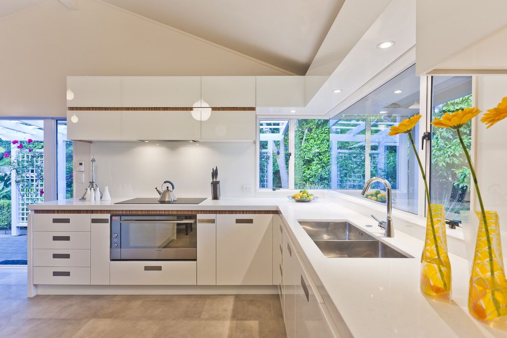 High Back Kitchen Sink   Contemporary Kitchen  and Ceiling Lighting Corner Windows Double Bowl Sink Kitchen Hardware Minimal Recessed Lighting Under Cabinet Lighting White Cabinets White Kitchen Wood Accent