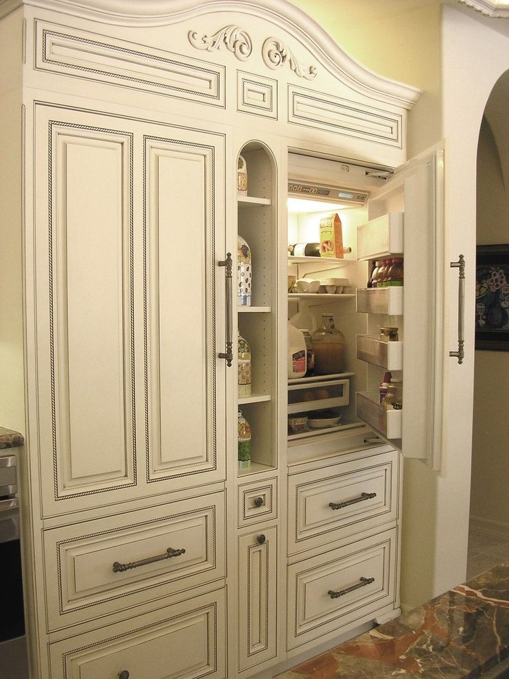 How Long Do Refrigerators Last   Traditional Kitchen Also Cabinet Front Refrigerator Carved Wood Cove Lighting Cubbies Distressed Furniture Door Handles Drawer Pulls Faux Finish Kitchen Hardware Panel Refrigerator White Cabinets Wood Cabinets Woodwork