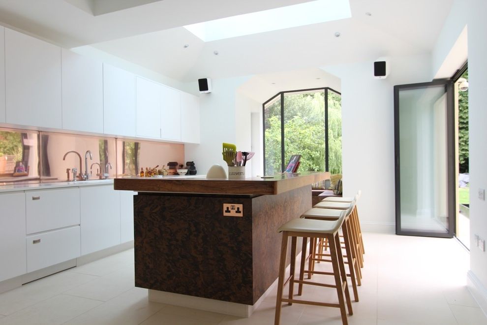How to Cut Sheet Metal   Contemporary Kitchen Also Airy Breakfast Bar Stools Bright and Airy Home Copper Backsplask Frosted Glass Door Geometric Shaped Windows Kitchen Island Kitchen Skylight Open Floor Plan Open Plan Living Skylight Wooden Worktop