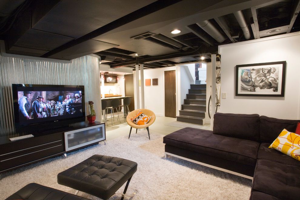 How to Paint Basement Ceiling   Industrial Basement Also Artwork Bar Basement Renovation Black Ceiling Black Leather Black Sofa Cgi Corrugated Galvanized Iron Counter Stools Exposed Ducting Floor Joists Media Room Seating Area Sectional Area Rug