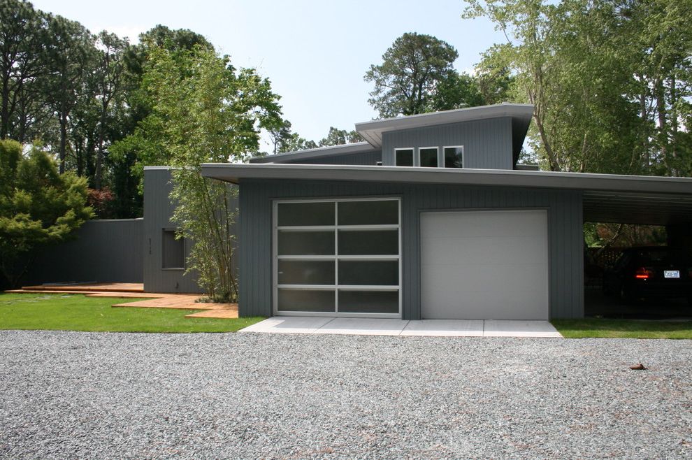 Insulated Glass Garage Doors   Modern Garage  and Carport Gravel Gray Lawn Slanted Roof Vertical Siding
