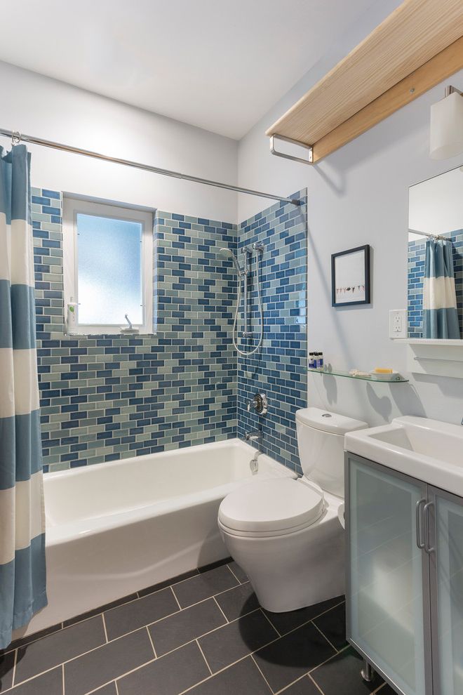 Kohler Villager Tub with Contemporary Bathroom  and Ann Sacks Bathroom Blue and White Shower Curtain Blue Tile Wall Charcoal Floor Handheld Shower Head Slate Three Wall Alcove Bathtub Translucent Sink Cabinets White Toilet White Tub White Walls