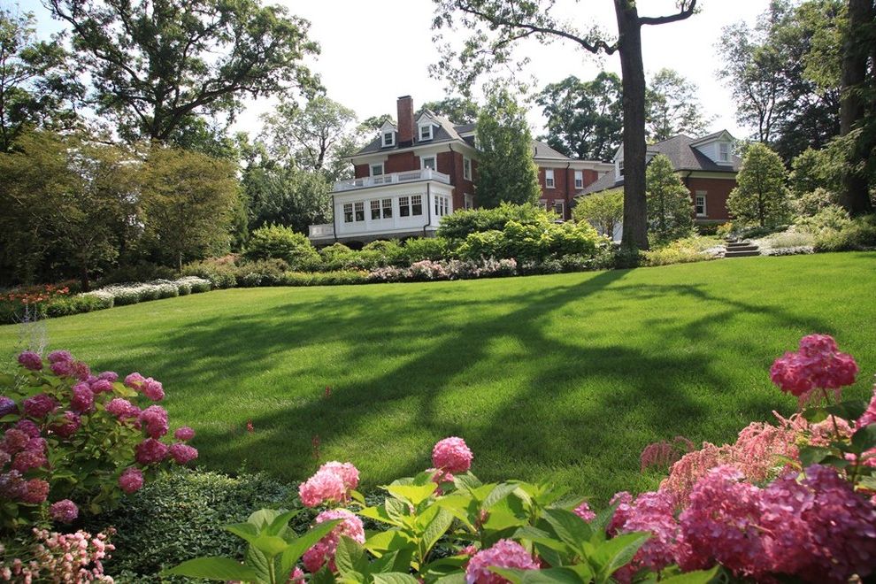 Lawn Care Chattanooga   Traditional Landscape  and Border Planting Brick House Flowering Border Grass Hillside Hydrangea Lawn Lawn Panel Perennial Pink Flowers Slope Turf