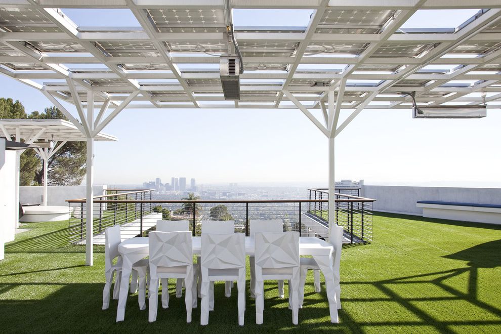 Lawn Service Montgomery Al with Modern Deck  and Al Fresco Dining City View Cityscape Contemporary Patio Furniture Deck Outdoor Dining Outdoor Dining Furniture Partial Cover Roof Deck Rooftop Solar Urban View View White Dining Chairs White Dining Table