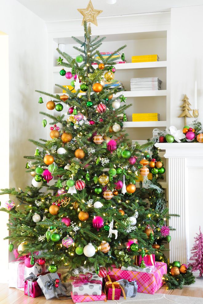 Lifelike Artificial Christmas Trees   Transitional Spaces Also Christmas Ornaments Christmas Tree Greige Walls Holiday Mantle Orange and Yellow Colour Scheme Orange Pillows Striped Drapery White Sofa