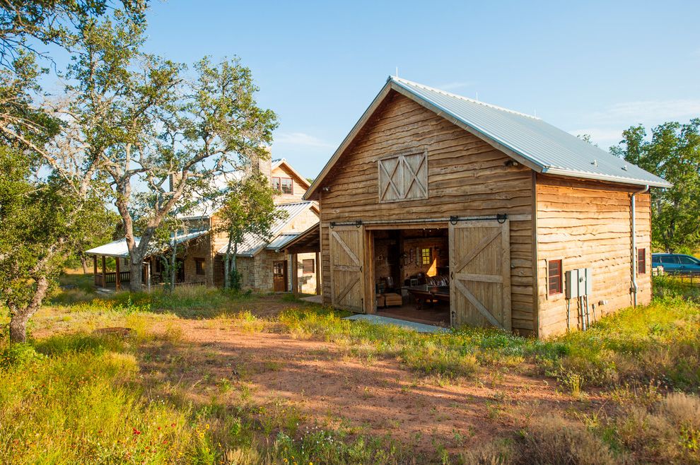 Loft Waco   Farmhouse Exterior  and Breezeway Gable Roof Lap Siding Metal Roof Natural Landscape Barn Rough Hewn Sliding Barn Doors