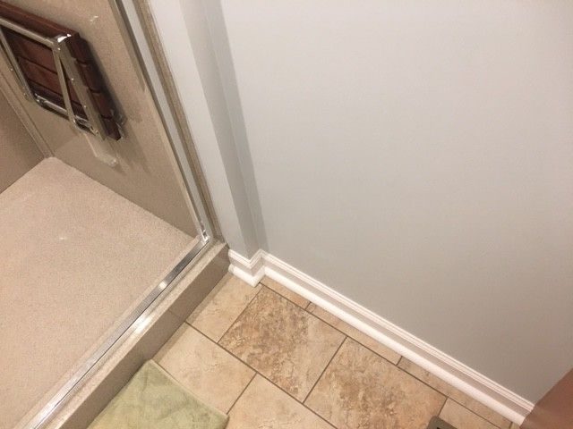 Lowes Beckley Wv with Traditional Spaces  and Crown Molding Culured Marble Shower Custom Lined Cabinets Custom Shower Door Tile Floor