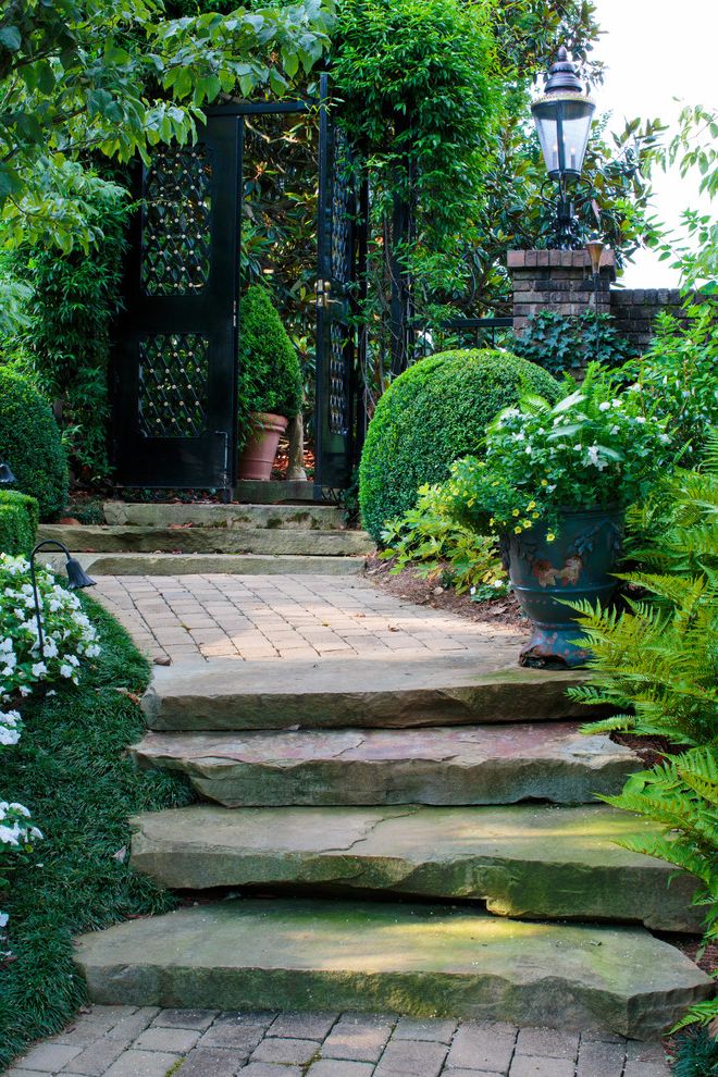 Lowes Knoxville Tn   Mediterranean Landscape  and Black Metal Gate Brick Pillar Ferns Garden Entry Garden Path Garden Path Lighting Groundcover Ivy Lantern Post Lush Greenery Painted Urn Potted Plants Stone Steps Topiary