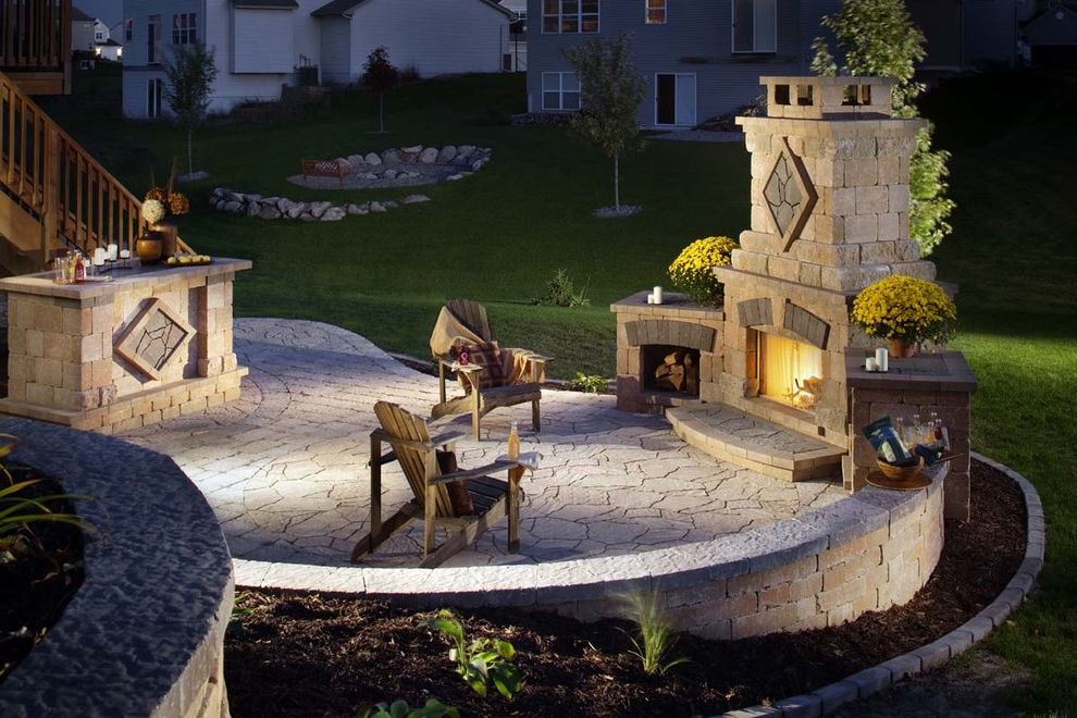 Mad Hatter Fireplace with Rustic Patio  and Adirondack Chairs Bar Chimney Exterior Fireplace Exterior Seating Grass Lawn Outdoor Entertaining Outdoor Fireplace Outdoor Seating Paver Planter Planting Retaining Wall Rustic Stone Turf