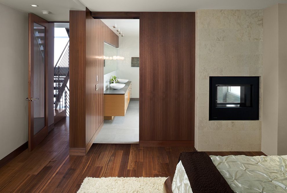 Manhattan Laminates   Modern Bedroom Also Baseboards Master Bedroom Stone Fireplace Surround Suite Wood Flooring Wood Paneling