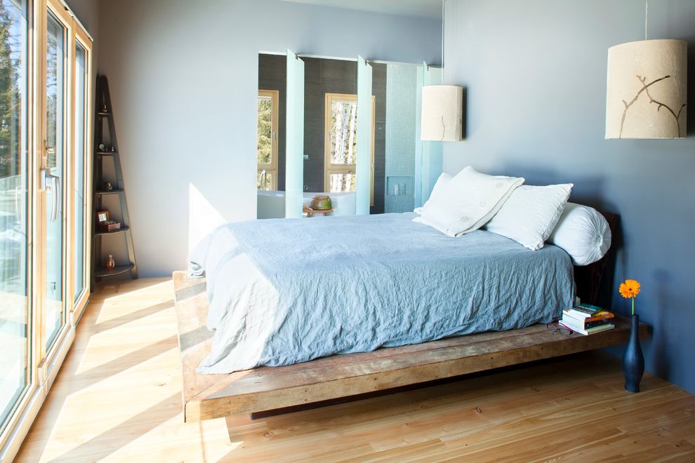 Masculine Bed Frames with Contemporary Bedroom Also Blue Ceiling Light Corner Shelf Floating Lights Floor to Ceiling Light Natural Light Platform Bed Wood Bed Wood Floor