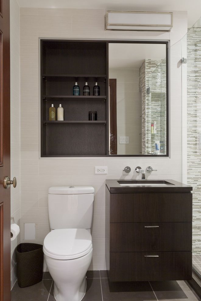 Medicine Cabinet with Electrical Outlet with Contemporary Bathroom Also Dark Stained Wood Floating Vanity Glass Shower Enclosure Medicine Cabinet Mirror Single Sink Tile Floor Tile Wall Wall Mount Faucet Wall Sconce White Walls