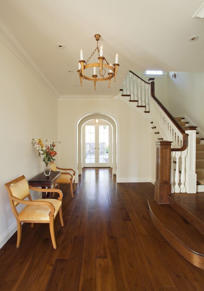 Mohawk Engineered Wood Flooring Reviews with Traditional Entry Also Archway Baseboards Ceiling Lighting Console Table Entry Chairs Foyer Front Door Neutral Colors Recessed Lighting Round Chandelier White Wood Wood Flooring Wood Molding Wood Staircase