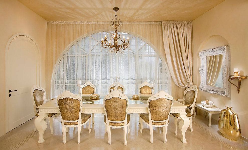 Mor Furniture Tacoma with Traditional Dining Room Also Archway Chandelier Curtains Drapes Formal Gold Louis Chair Metallic Monochromatic Ornate Pendant Lighting Stone Flooring Wall Mirror White Dining Chairs White Dining Table Window Treatments