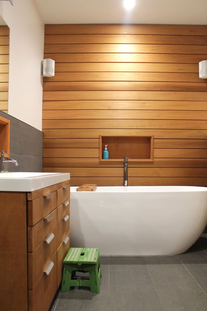 Multigenerational Homes   Transitional Bathroom  and Bath Caddy Clean Lines Niche Recessed Lighting Spa Bath Storage Vanity Wood Panel Wall