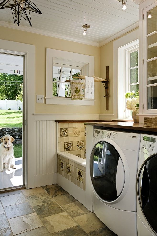 My Dog Keeps Peeing with Traditional Laundry Room  and Back Door Bead Board Dog Wash Area Drying Rack Glass Front Cabinets Painted Wood Ceiling Star Pendant Tile Floor Washer and Dryer White Trim