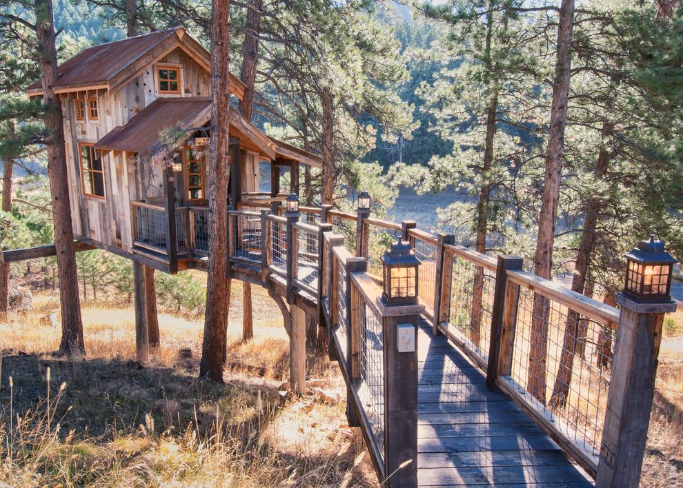 Odyssey House of Utah with Rustic Exterior  and Bridge Gable Roof House on Stilts Lanterns Rusted Metal Roof Rustic Wood Exterior Water View Wire Mesh Railing Wood Decking Wood Railing Woodsy