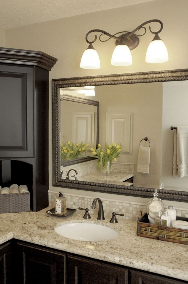 Oil Rubbed Bronze Wall Mirror with Traditional Bathroom Also Bath Accessories Bathroom Mirror Dark Wood Cabinets Fireplace Granite Countertops Neutral Colors Sconce Wall Lighting