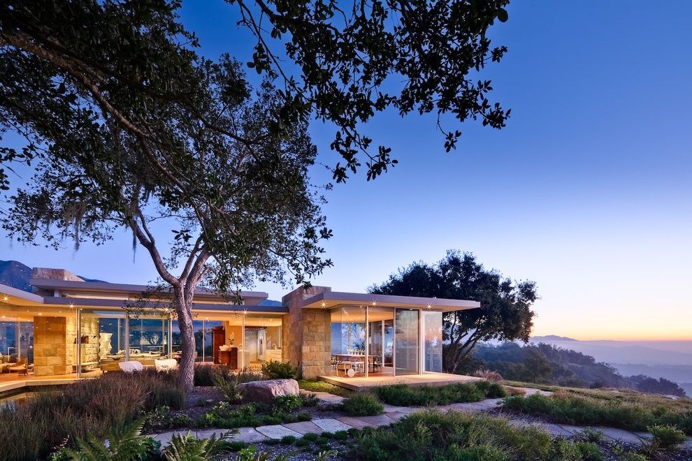 Paso Robles Glass with Modern Exterior Also Boulders Flat Roof Glass House Hilltop Oversized Windows Picture Windows Rocks Roof Overhang Stone Exterior Stone Pathway Stone Pavers Stone Siding Stone Walkway Tall Grass Trees View Window Wall