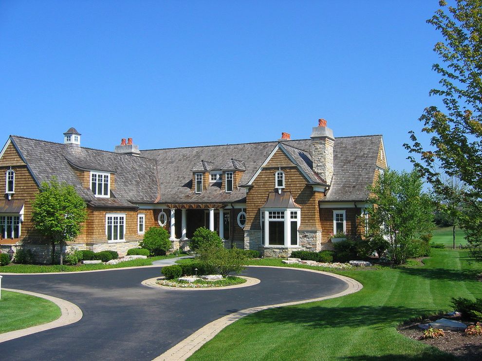 Paver Driveway Cost with Victorian Exterior  and Bay Window Cedar Shingles Cupola Curved Roof Dormers Driveway Driveway Island Front Door Gables Oval Windows Porch Rafters Shingle Style Stone Chimney Stone Details White Trim