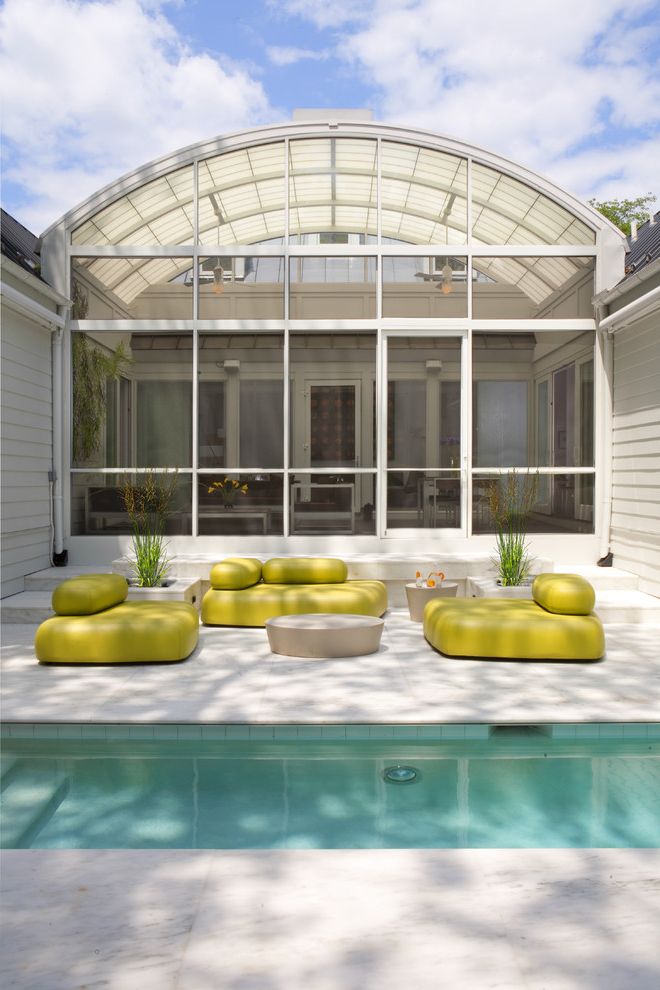 Penny Mustard Furniture   Transitional Pool Also Accent Color Arched Roof Glass Wall Lounge Area Minimal Neon Green Outdoor Steps Patio Furniture Planters Roof Line Stone Paving Sunroom