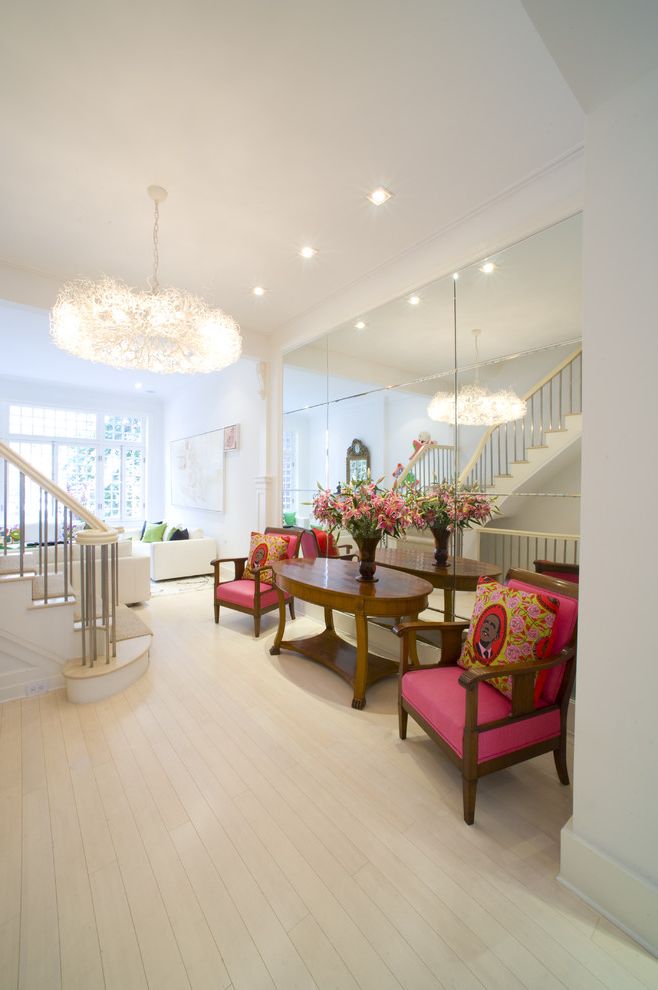 Pier One Wall Mirrors   Contemporary Entry Also Chandelier Crown Molding Mirrored Wall Obama Pillow Oval Console Table Pink Arm Chairs Staircase White Walls White Wood Floor