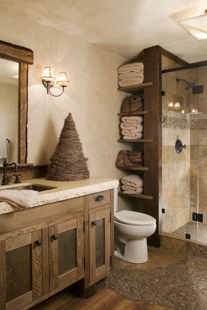 Places to Visit in Austin with Rustic Bathroom  and Beige Countertop Ceiling Light Found Wood Framed Mirror Open Shelves Pebble Tile Reclaimed Wood Wall Sconce